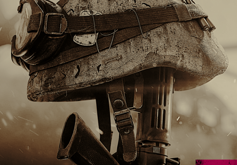 Close-up of a weathered military helmet with goggles strapped on, resting atop a rifle in a sepia-toned image.